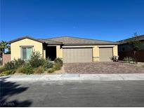 Charming single-story home with a three-car garage and desert landscaping for low maintenance at 3706 Etendre Ct, Las Vegas, NV 89121