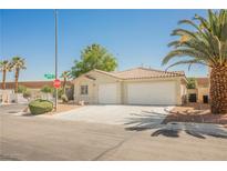 Charming single-story home featuring a two-car garage, desert landscaping, and a welcoming facade at 7754 Pink Ginger St, Las Vegas, NV 89123
