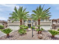 Beautiful two-story home with desert landscaping, a dual garage, and a second-story balcony at 9046 Barium Rock Ave, Las Vegas, NV 89143
