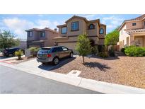 Charming two-story home with desert landscaping, a concrete driveway, and a well-maintained exterior at 9513 Perennial View Ave, Las Vegas, NV 89148