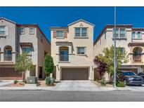 Charming two-story home with a well-manicured front yard and a two-car garage at 10519 Mann St, Las Vegas, NV 89141