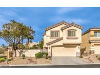 Charming two-story home with a two-car garage and desert landscaping at 170 Wicked Wedge Way, Las Vegas, NV 89148