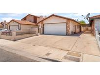 Charming single-story home with a two-car garage and low-maintenance landscaping at 1729 Yellow Rose St, Las Vegas, NV 89108