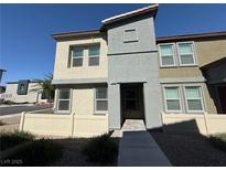 Modern two-story home featuring neutral-tone stucco, trimmed windows, and a walkway to the front door at 1906 Arietta Vista St, Henderson, NV 89044