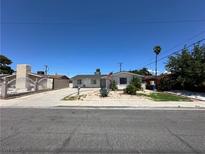 Charming single-story home featuring a well-maintained gravel front yard and a classic white exterior at 5804 Apple Valley Ln, Las Vegas, NV 89108