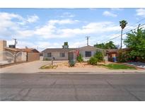 Charming single-story home with a well-maintained front yard and driveway at 5804 Apple Valley Ln, Las Vegas, NV 89108