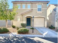 Two-story home with desert landscaping, covered entry, attached garage and concrete driveway at 7249 Old Glory St, Las Vegas, NV 89148