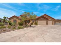 Charming single-story home featuring a well-manicured front yard and a spacious three-car garage at 7668 Friendly Breeze Ct, Las Vegas, NV 89123