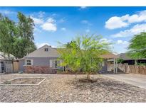 Charming single story home with gray exterior, brick detail, drought landscaping, and mature tree at 1320 Wengert Ave, Las Vegas, NV 89104