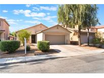 Charming single-story home featuring a two-car garage and well-manicured landscaping at 2833 Swanson Ave, North Las Vegas, NV 89086