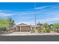 Charming single-story home featuring desert landscaping, a covered carport, and a welcoming entrance at 3101 Greenbriar Dr, Las Vegas, NV 89121