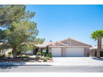 Charming single-story home with a well-manicured lawn, mature tree, and a two-car garage at 6417 Fisher Ave, Las Vegas, NV 89130