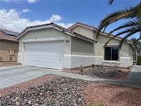 Charming single-story home with a two-car garage, desert landscaping, and well-maintained exterior at 7812 Sedalia St, Las Vegas, NV 89139