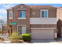 Inviting two-story home with a neat front yard and an attached two-car garage at 9021 Last Hope Ave, Las Vegas, NV 89178