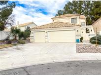 Charming two-story home featuring a spacious three-car garage and landscaped front yard at 9552 Wooden Pier Way, Las Vegas, NV 89117