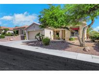 Charming single-story home with a well-maintained front yard and two-car garage in a desirable neighborhood at 10532 Sea Palms Ave, Las Vegas, NV 89134
