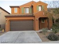 Attractive two-story home featuring an attached two car garage and desert landscaping at 11014 Great Sioux Rd, Las Vegas, NV 89179