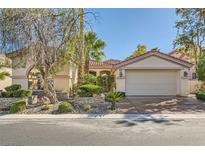 Charming single-story home features a well-manicured front yard and attached two-car garage at 151 Cliff Valley Dr, Las Vegas, NV 89148
