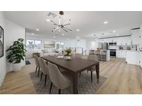 Open-concept living space featuring a dining area, modern lighting, and a stylish kitchen with stainless steel appliances at 2521 Richfield Blvd, Las Vegas, NV 89102