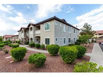 Inviting condo exterior with manicured landscaping and a community atmosphere at 3515 Cactus Shadow St # 104, Las Vegas, NV 89129