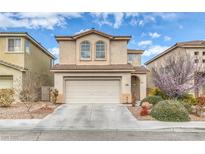 Two-story home featuring a two-car garage, low maintenance desert landscaping, and a neutral color palette at 3964 Irvin Ave, Las Vegas, NV 89141