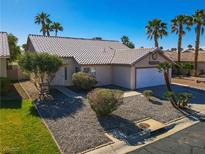 Charming single-story home features a well-maintained front yard with desert landscaping and a two-car garage at 4653 Califa Dr, Las Vegas, NV 89122