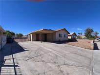 Single-story home featuring a covered carport and a spacious front yard with desert landscaping at 4748 Terra Linda Ave, Las Vegas, NV 89120