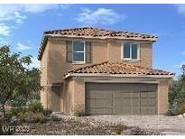 Two-story home with a tile roof and a two-car garage, offering classic suburban charm at 9661 Hinson St, Las Vegas, NV 89139