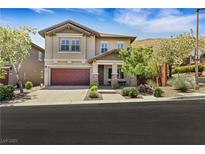 Charming two-story home with a manicured front yard and an inviting covered porch at 10697 Acacia Park Pl, Las Vegas, NV 89135