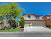 Charming two-story home with stucco exterior, well-manicured lawn, and a two car garage at 11444 Steponia Bay St, Las Vegas, NV 89141