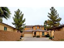 Charming two-story home featuring desert landscaping, a tile roof, and a welcoming front entrance at 153 Via Di Mello, Henderson, NV 89011