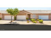 Charming single-story home featuring a two-car garage and well-maintained landscaping at 199 Bailey Island Dr, Henderson, NV 89074