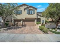 Charming two-story home with a brick driveway and three-car garage at 205 Piedmont Alps St, Henderson, NV 89012
