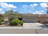 Beautiful single-story home with a two-car garage, desert landscaping and a tile roof at 2108 Willow Wren Dr, North Las Vegas, NV 89084