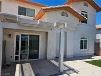 Inviting home exterior with a covered patio and stucco siding with great curb appeal at 236 Star Cluster Cir, Las Vegas, NV 89145