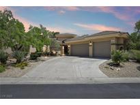 Beautiful single-story home featuring a spacious driveway, mature trees and a well-manicured front yard at 304 Cambrian Ridge Ct, Las Vegas, NV 89144