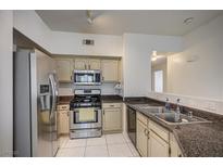 Traditional kitchen featuring stainless steel appliances and marble countertops at 3400 Cabana Dr # 1068, Las Vegas, NV 89122