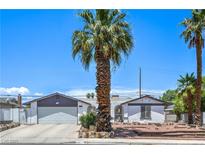 Charming single-story home featuring desert landscaping and an attached two-car garage at 4461 Greenhill Dr, Las Vegas, NV 89121