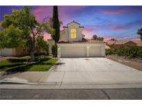 Charming home featuring a three car garage, mature landscaping, and a classic red tiled roof at 4521 Crimson Leaf Dr, Las Vegas, NV 89130