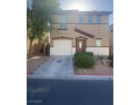 Two story home showcasing a two car garage, landscaped yard, and a charming entryway at 523 Cabis Bay St, Las Vegas, NV 89178