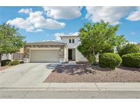 Charming home with a stone-accented facade, well-manicured landscaping, and a spacious two-car garage at 564 Lampshire Ln, Pahrump, NV 89060