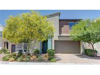 Attractive two-story home showcasing manicured landscaping and a convenient two-car garage at 8335 Beaten Path Ct, Las Vegas, NV 89166