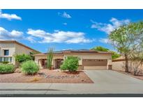 Charming single-story home with a well-manicured desert landscape and two car garage at 9142 Royal Monarch Ct, Las Vegas, NV 89147