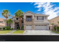 Two-story home with a three-car garage, stone accents, balcony, and palm trees at 10761 Capesthorne Way, Las Vegas, NV 89135