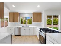 Bright kitchen with stainless steel appliances, white countertops, and a window view at 2913 Hawksdale Dr, Las Vegas, NV 89134