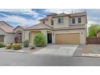 Charming two-story home features desert landscaping and a two-car garage at 3743 Prairie Orchid Ave, North Las Vegas, NV 89081