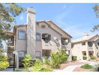 Lovely multi-story condo with stucco exterior, balconies and desert landscaping at 5415 W Harmon Ave # 2094, Las Vegas, NV 89103