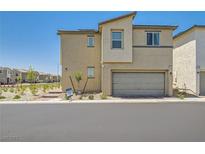 Modern two-story home with a two-car garage and low-maintenance landscaping at 6835 Orange Horizon St, North Las Vegas, NV 89086