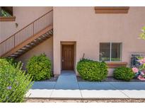 Charming condo entrance with well-kept landscaping and private stairway at 1050 E Cactus Ave # 1128, Las Vegas, NV 89183