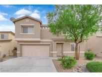 Charming two-story home featuring a two-car garage and well-maintained landscaping at 125 Sharp Edge Ave, North Las Vegas, NV 89031